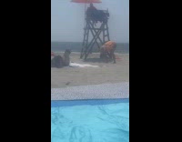 Lifeguard vomiting at the beach