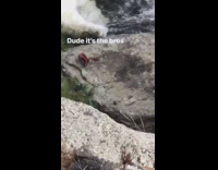 Three men stacked together rock river bag