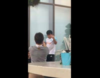 Mother films son blue white shirt dance