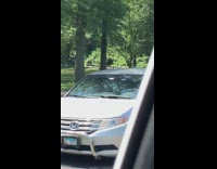 Guy rides bicycle with no front tire