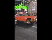 Orange lowrider car in times square
