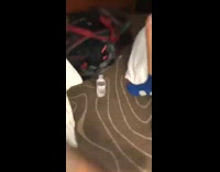 Guy throws water bottle at ceiling and it lands up right bottle flip