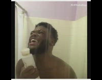 Guy sings different songs in the shower and uses Pantene shampoo bottle as microphone