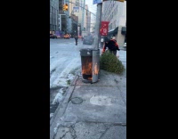 Trash bin burning on the street