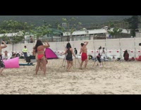 Women at Beach Dance and Film Workout Video 