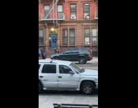 Woman smashing mans car with chair 