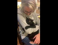 BitchMP - Woman hugging and cuddling black cat
