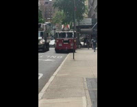 FDNY truck with tire on curb 
