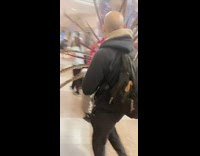 man carrying feather headdress 