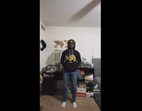 Guy black hoodie unicorn costume jump dance