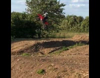 Guy on red bike jumps off ramp fail