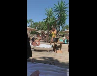 Gold bathing suit girl photographs friend pool 