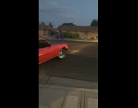 Vintage car pulls out of driveway 