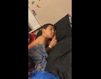 Little boy sleeping sour face 