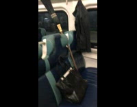 Black harry potter broom in empty seat on subway