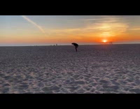 Man bends butt for beach sunset photoshoot