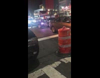 Two clowns driving in low rider car night time