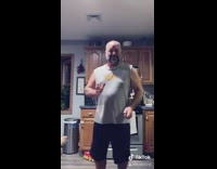 Dad tiktok dances dog bites butt kitchen 