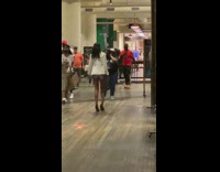 White jacket girl walks towards guy photographer