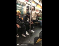 Woman standing on subway sings out loud for train to hear