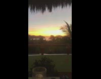 Guy hat phone take panorama picture sunset 