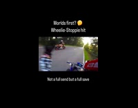 Riders does wheelies almost hit each other