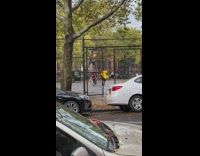 Yellow pac man costume outdoor basketball court