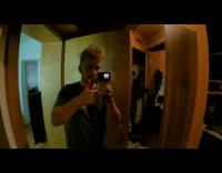 Guy rides white surfboard in river water 