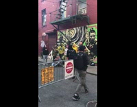 Group of Clown Men Stand in Front of Mural 