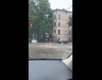 Filmer shows street intersection flooded with water