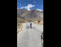Man outbalanced and fell on the longboard at the downhill road
