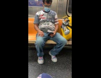 Guy yellow robot arm subway blue glasses 