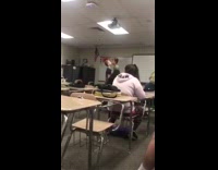 Two guys kids fighting in classroom
