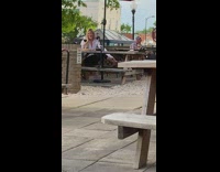 White jacket girl restaurant patio wine phone 