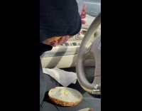 Girl struggles to spread cream cheese bagel 