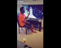 Orange shirt guy sits television model runway 