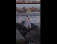 Guy sings while person plays horn 