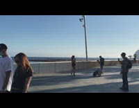 Woman black backless dress dance beach railings part 1