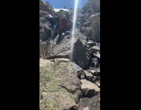 One piece bathing suit girl waterfall snow 