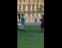 Guy sprays cologne drone records him park