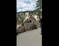 Woman pink shirt sit rock pictorial traveler