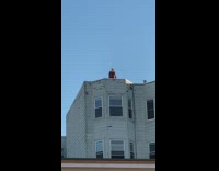 Blonde girl backless dress pose on rooftop