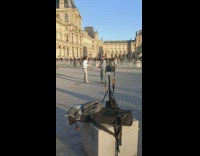 Two men with flute and maracas performs at the park