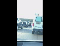 Woman yoga middle of car traffic jam