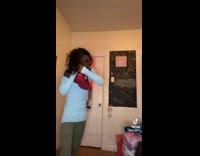 Guy wearing dress helps his girlfriend fight