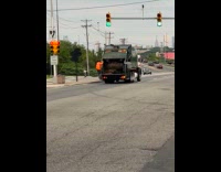 Collab WINY - Two guys hang at the back of garbage truck