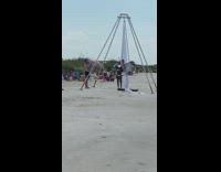 Girl sit on silk aerial yoga beach