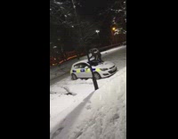 Black sweater guy climbs parked white car 