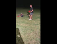 Two little boys boxing swing hits stomach