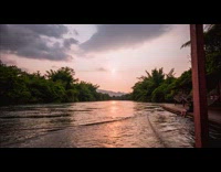 Time lapse river floating wood deck with hammock